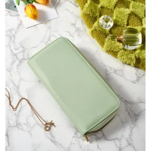 Detailed view of the mint green zipper travel wallet and organizer for jewelry and essentials.