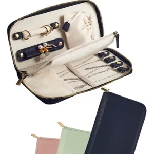 Portable travel jewelry organizer bag with compartments for rings earrings necklaces storage.