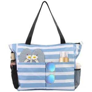 Large waterproof blue and white striped beach tote bag with multiple pockets for travel.