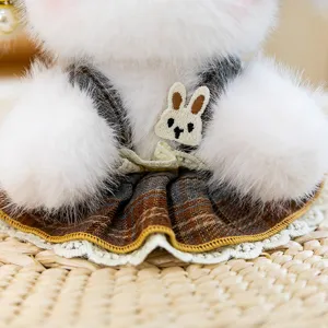 Plush toy pendant close-up, cute plaid dress with rabbit embroidery, fluffy texture, bag decor.