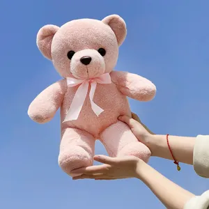Cute pink teddy bear plush toy with bow tie, soft stuffed doll for kids gift and home decor.