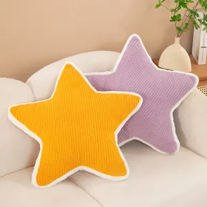 Close-up of cozy plush star pillows in yellow and purple, perfect for sofa decor and comfort.