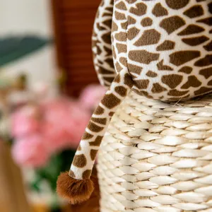 Cute giraffe plush toy detail shot, soft stuffed animal for girls, cozy home decor.