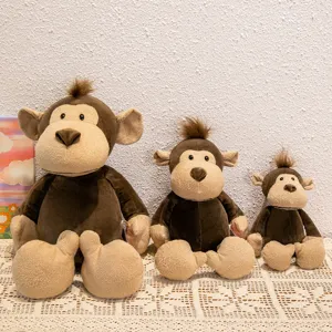 Cute sitting plush monkey toy set, soft textured jungle animal detail view, cozy home decor.
