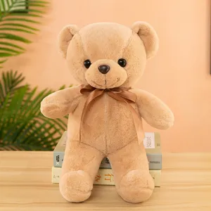 Close-up of a soft brown teddy bear plush toy featuring a cute bow tie and detailed plush fur.