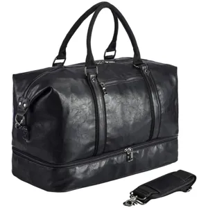 Black travel duffel bag with bottom compartment and shoulder strap, detail view for travel.