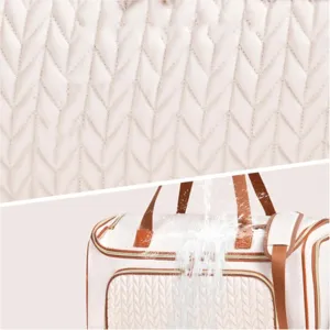 Waterproof travel duffel bag detail, quilted fabric texture close-up and functional design.