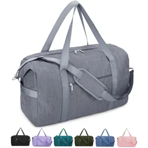 Large capacity travel duffel bag for gym, sports, and business trips with shoulder strap.