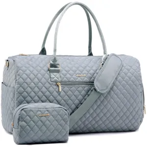 Light blue quilted travel duffel bag with matching cosmetic pouch, perfect for gym and trips.