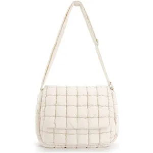 Detail shot of white quilted padded crossbody bag featuring grid pattern and adjustable strap.