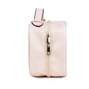 Pink leather travel cosmetic bag side view waterproof makeup organizer with handle for women
