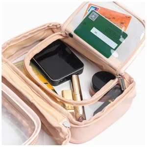 Detail view of pink travel cosmetic bag interior, multi-compartment storage organizer.