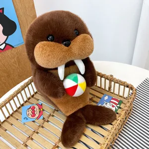Cute walrus plush toy holding a small beach ball, soft stuffed animal doll for kids.