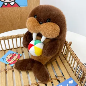Cute walrus plush toy holding a small colorful ball, soft stuffed animal doll for kids gift.