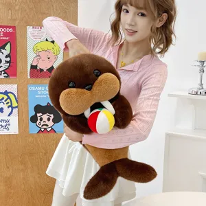 Cute walrus plush toy holding a small ball, soft stuffed animal doll for kids gift.