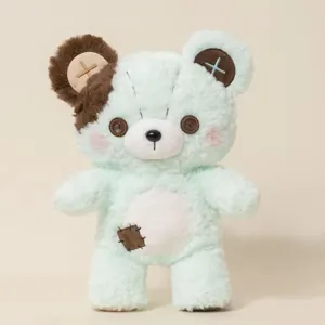 Cute mint green plush teddy bear detail featuring button eyes, patches, and soft fabric.