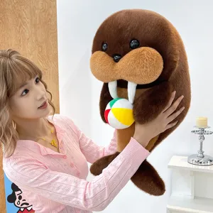 Cute walrus plush toy holding a small ball, soft ocean animal doll for kids birthday gift.