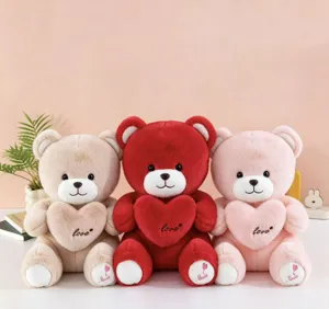 Süßer Plüsch Teddybär Spielzeug mit Herz Kissen, weiches Stofftier Geschenk für Kinder.