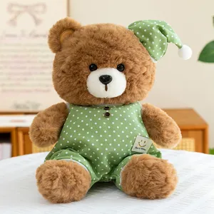 Cute sleeping bear plush toy with green polka dot pajamas, soft stuffed animal gift for girls.
