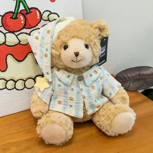 Plush toy bear detail view, wearing cute pyjamas and sleeping cap, soft and comforting doll.