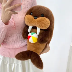 Cute walrus plush toy holding a small colorful ball, soft stuffed animal doll pillow for kids.