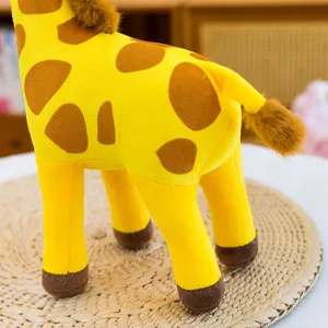 Detailed closeup view of soft plush giraffe toy featuring vibrant yellow patterns.