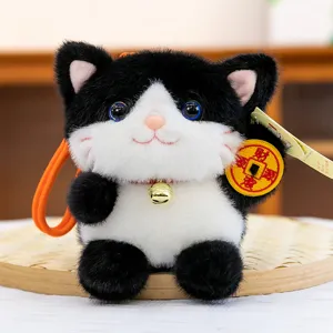 Cute black and white plush lucky cat pendant toy with bell and lucky coin.