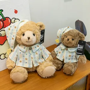 Cute couple teddy bear plush toys wearing matching pyjamas and sleeping caps, soft stuffed animal doll.