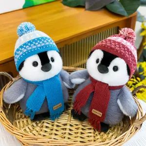Cute winter penguin plush toy with knit hat and scarf, perfect birthday gift and home decor.