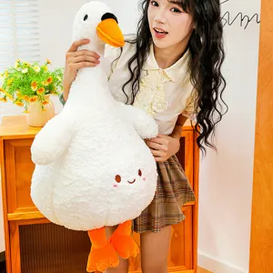 Cute white goose plush toy detail shot, soft stuffed duck doll hugging pillow, cozy room decor