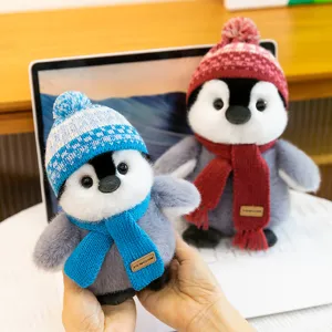 Cute winter penguin plush toy stuffed animal with knit hat and scarf for kids birthday gift.