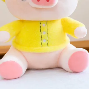 Detailed view of a cute plush pig doll in a yellow shirt, soft and cozy toy gift for girls.