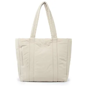Detail view of the beige quilted puffer tote bag, showing soft padded texture and spacious design.