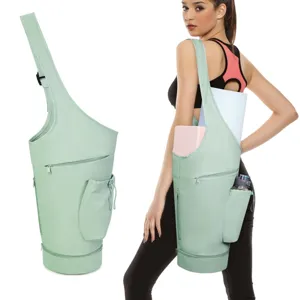 Light green yoga mat carrier bag with water bottle pocket, wet compartment and adjustable strap.