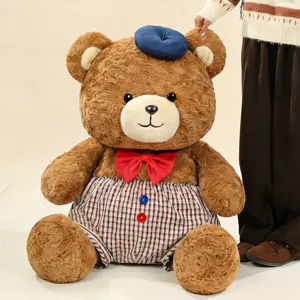 Cute brown teddy bear plush toy with bow tie and plaid shorts, soft doll for kids gift.