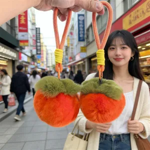 Cute persimmon plush bag charm keychain, soft faux rabbit fur pompom pendant for gifts.