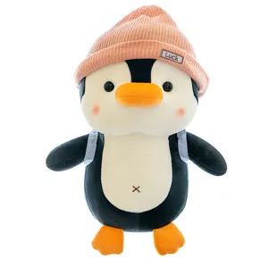 Cute penguin plush toy stuffed animal with travel backpack and pink knitted hat for kids