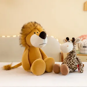 Closeup shot of cute jungle animal plush toys, soft lion and giraffe for cozy home decor.