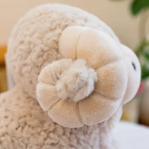 Plush sheep toy detail close up showing soft curly wool horn texture for cute stuffed animals