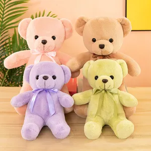 Detailed shot of multi-color plush teddy bear toys with ribbons, cute and soft display.
