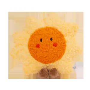 Close up view of the soft yellow sun plush toy, showing fluffy fabric texture and cute face.