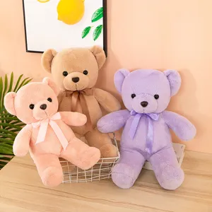 Detailed view of cute colorful plush teddy bear toys with lovely satin bow ties.
