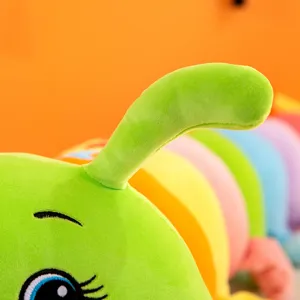 Detailed close-up of a colorful rainbow caterpillar plush toy, soft stuffed animal pillow.