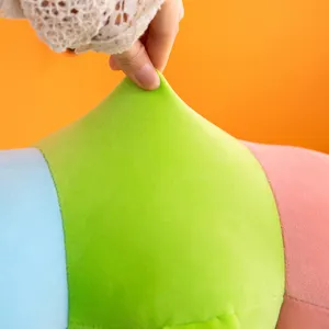 Detail shot of the colorful caterpillar plush toy, highlighting soft stretch fabric and stuffing.