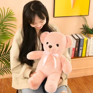 Soft pink teddy bear plush toy with bow, cute huggable stuffed animal doll for kids gift.