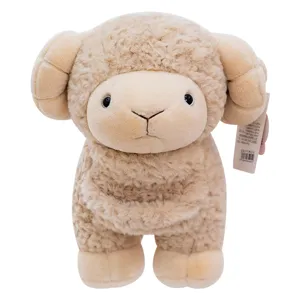 Detailed close-up view of the cute fluffy cream lamb plush toy with soft curled horns.