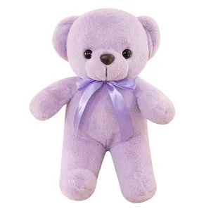 Cute purple teddy bear plush toy with a soft ribbon bow, perfect gift for kids and girls.