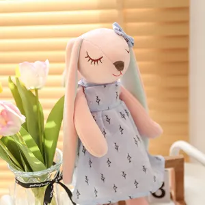 Cute plush rabbit toy with soft pink body and blue dress sweet girl gift companion doll