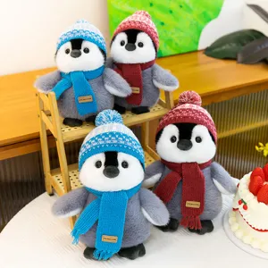 Cute winter penguin plush toy doll with hat and scarf, perfect birthday gift and home decoration.