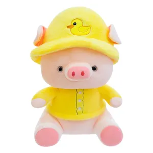 Cute plush pig toy detail showing soft pink body, yellow duck hat and cozy stuffed doll texture.